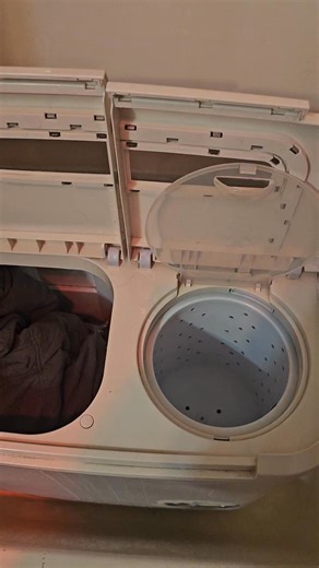 Krysta Everett on Instagram: "Watch me shove my comforter in my tiny portable washer Spinner 🤣🤣🤣 #fypシ゚viralシ #reelsfypシ #momlife #engagement"