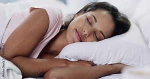 Peace, relax and woman sleeping in bed with duvet blanket for comfort at modern apartment. Calm, morning and beautiful young female person from Mexico taking a nap and laying in bedroom at home.