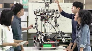Asian engineer collaborating development robot in modern laboratory. Developers experiment control microchip and build electronics. concept of technology, robotic engineering, and industrial robot.