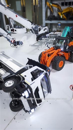 MD 6*6 1/14 Metal Hydraulic RC Dumper Truck accidentally overturned while working, but the real hero - the JDM198 1/14 RC Hydraulic Metal Loader appearance! With an all-metal transmission structure, it has an extremely strong load-bearing capacity and a power output unassailable, easily lifting the dump truck. Construction site, be careful of safety. Because the place where you are may not have such a loader to "come to your rescue". #RCModel #RCWorld #RC #DumperTruck #Toucanhobby | Toucanhobby 