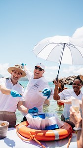 The crystal-clear waters of Carambola Beach often make for a memorable day in the Caribbean sun – for Seabourn guests, the pristine beach also gives way to a floating surfboard of caviar, a day of cherished memories. A beloved Seabourn signature event, Caviar in the Surf is a beach BBQ like no other, allowing guests to enjoy caviar and Champagne amongst the waves, and grilled lobster throughout the day. What is your favorite part of Caviar in the Surf? | Seabourn