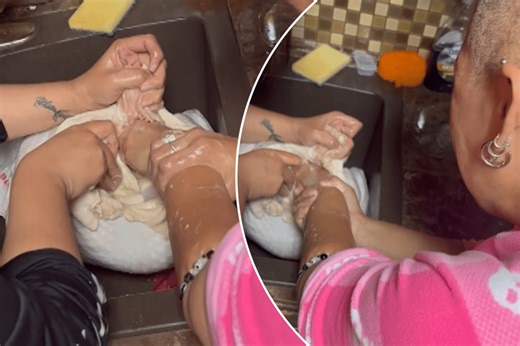 Hilarious moment mom gets her hand stuck in Thanksgiving turkey