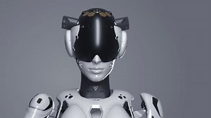 the robot makes a gesture with his index finger