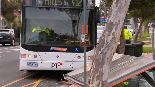 Woman rushed to hospital after bus crashes into shelter in Melbourne
