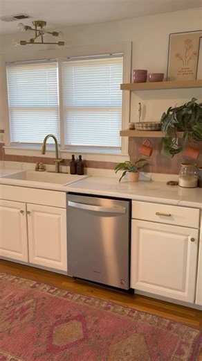 Welcome Spring with a fresh view! 🌼🔆 Take a peek at this amazing transformation. Our Designer Series Woven Wood Shades breathe new life into this stunning kitchen! Don't miss out on the opportunity to save up to 50% off your order! | SelectBlinds