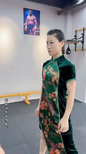 Feast your eyes, young grasshoppers! Observe the grace embedded in every thread of her stunning attire, contrasted with the fierce power of her kick. Elegance meets fire in this captivating display, where style and martial prowess intertwine. Would you not agree that such a dance of strength and beauty is a sight to behold? . . . #KungFuFashion #StyleMeetsStrength #KickLikeAGirl | Martial Arts