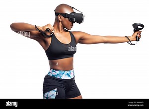 Black female wearing virtual reality headset pretending to draw a bow and playing a VR archery video game.  She is aiming at a target. Depicts esports Stock Photo - Alamy
