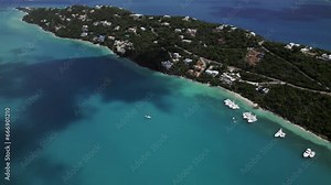 Amazing aerial view boats in water homes on mountain magen's bay st. thomas coki beach sapphire beach turquoise water waves blue sky white clouds east end red hook hills and mountains sun gleaming