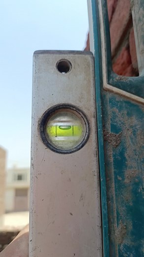 Using a Spirit Level for Perfect Wall Construction