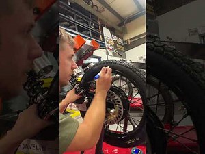 Setting a motorcycle tire bead and balancing a brake disc