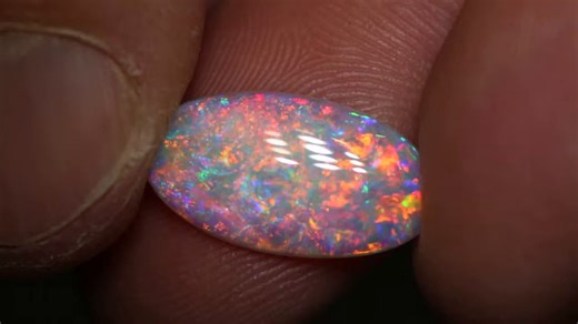 4.2K views · 243 reactions | A rainbow-bright gem Crystal Opal  With shimmering floral patterns of blue, green, orange and pink  3.12ct crystal opal gem 18x10x3mm https://blackopaldirect.com/product/opal/crystal-opal/3-12-ct-crystal-opal-gem-18x10x3mm/ | Black Opal Direct | Facebook
