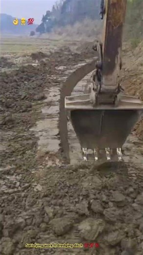 Precision excavator dredging ditch … Skilled operator