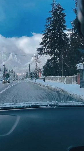 Have you ever stood in the cradle of the cosmos? In the Bucegi Mountains that sensation arrives like a quiet revelation as Romania’s stone bastions surge upward from the modest streets of Bușteni. Their winter mantle glitters with an austere sanctity, each ridge carved as if to prop up the very heavens. The cold settles with ceremonial weight, and the vastness around you feels both humbling and strangely invigorating. These heights hold more than scenery. Omu ascends to 2,505 meters, its summit 