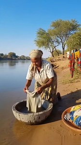 Old woman washing her clothes at the river unfortunately the owners of the river popped out #movie #motivational | Violet Masuka