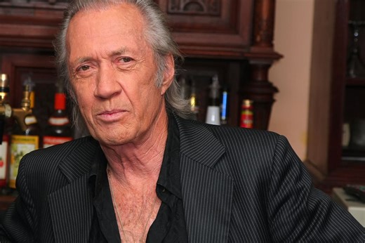 What happened to Robert Carradine's half-brother David Carradine?