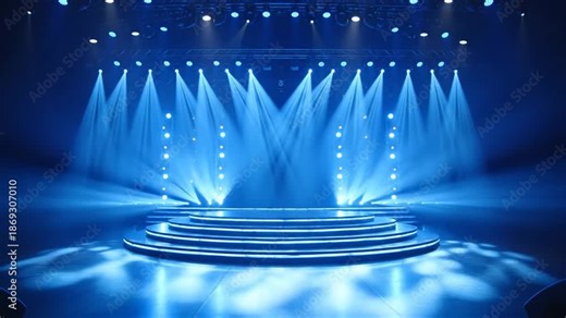 A circular stage with blue spotlights shining down on it in a dark environment