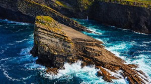 Epic waves meet ancient rocks