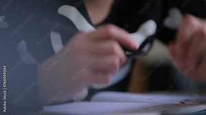 In Elementary School Class Student writes in notebook. education, elementary school, learning and people concept - group of school kids with pens and notebooks writing test in classroom