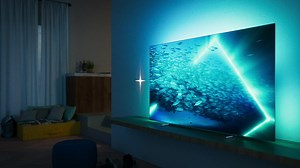 🌟Philips OLED707超進化視聽體驗🏆 無論影音娛樂🎬、電競遊戲🎮、音樂串流🎼帶給你前所未有的震撼感! 🖥氣氛超進化 獨家Ambilight 情境光源，根據畫面內容變換光線動態，帶您沉浸在電影、遊戲、音樂當中。 🖥畫質超進化 獨家P5 AI完美畫質調校技術，自動補強色彩、流暢度、銳利度與對比度 🖥感官超進化 杜比天空聲道與杜比視界，劇院級視聽享受 🖥暢打超進化 120Hz FreeSync，極致流暢的遊戲體驗，領先對手成為遊戲王者 🖥美型超進化 超薄金屬鑲邊與絲光鍍鉻金屬支架，展現真正時尚感 #PhilipsTV #OLED707 #大型顯示器 #超進化視聽饗宴 | Philips TV