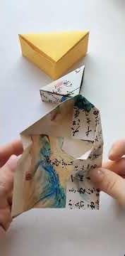 Method for folding a triangular storage box from a piece of paper