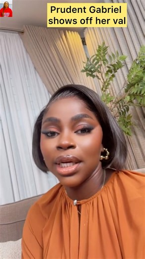 Nigerian designer, Prudent Gabriel proudly shows off her val. They look so adorable together