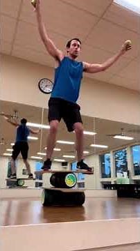 Man Balances on Indo Boards and Performs Different Tricks - 1414571-1