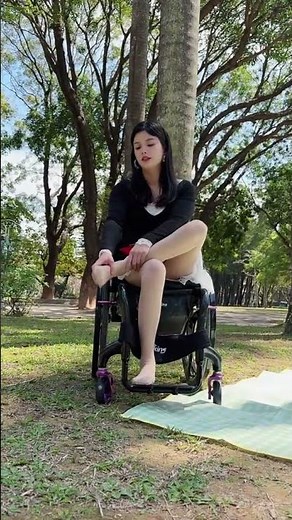 Jenny paraplegic woman putting heels on her paralyzed feet