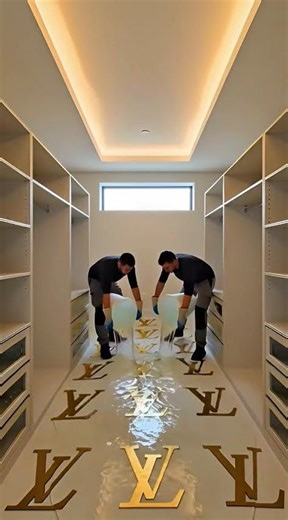 Luxury walk-in closet transformation with Louis Vuitton-inspired LV logos embossed under clear epoxy