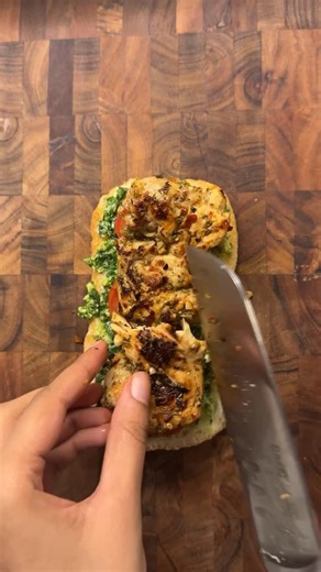 Hafsaa | Clinical Nutritionist on Instagram: "It’s almost 2026, a little embarrassing if ‘go make a sandwich’ is still your fav insult. Pesto Chicken Panini but with a lil olive salsa🫒 Olive salsa: Green and black olives Colored bell peppers Lemon juice Salt and pepper Quick and easy Pesto; Fresh basil Cashews Garlic Parmesan Olive oil Salt Pepper Italian Chicken marinade: Loads of garlic Heap of mixed Italian seasoning (oregano, parsley, thyme, dried basil) Salt Pepper Chilli flakes Olive oil"