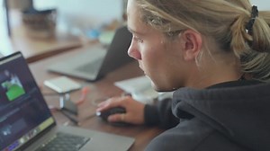 A blonde man works on a laptop in his home office - Free Stock Video Footage | Coverr