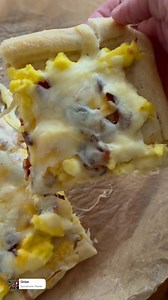 Breakfast Pizza This is such a fun and easy breakfast for the weekends. It’s loaded with scrambled eggs, bacon and lots of cheese for the ultimate pizza for breakfast. We drizzled ours with ranch but it’s totally customizable to any of your favorite breakfast toppings. Save this one for the holidays it’s a keeper! 1 refrigerated pizza dough 8-9 eggs 1/3 c milk Salt 3 tablespoons butter 4-6 slices bacon cooked crumbled 1 c shredded cheddar 1 c shredded mozzarella Ranch dressing optional Roll out 