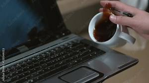 Spilling coffee on laptop computer slow motion; shot on Phantom Flex 4K at 1000 fps