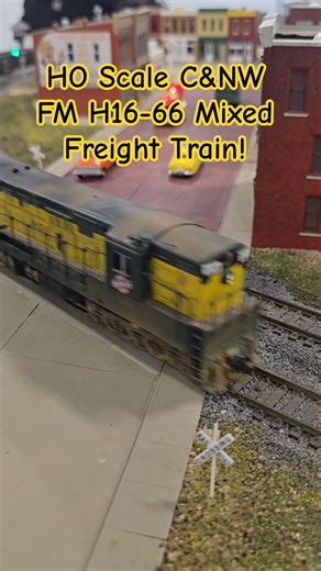 HO Scale C&NW FM H16-66 Mixed Freight Train Runs Through Town Crossing!