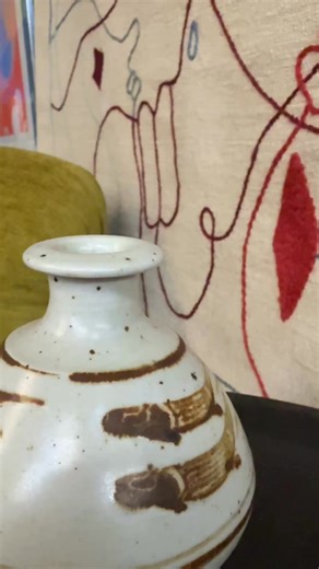 Bernard Leach is considered the father of British studio pottery. In 1920 he co-founded Leach Pottery in St. Ives, Cornwall with Shoji Hamada and is known for blending eastern traditions with western techniques. This Leaping Fish vase is currently available in our latest Fine Estates Auction with online bidding through our website, mobile app, and LiveAuctioneers. | Briggs Auction, Inc.