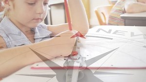 Animation of compass with text over caucasian girl writing in notebook. Global education, learning and digital interface concept digitally generated video.