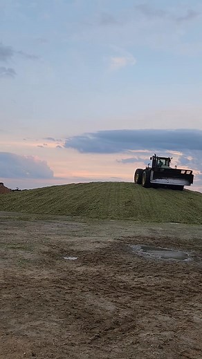 Up and down, pushing, and packing the silage pile. | Dakin Dairy Farms