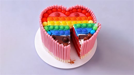 Rainbow heart cake with colorful candy layers