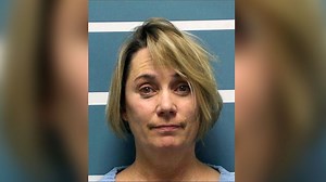 Teacher arrested after video shows her forcibly cutting student's hair while singing national anthem