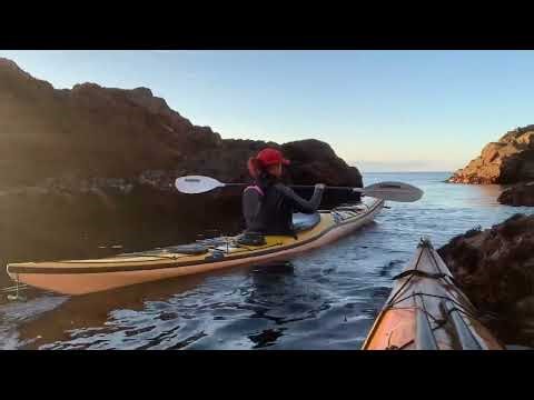 The surge play sea kayak on a a sunset paddle