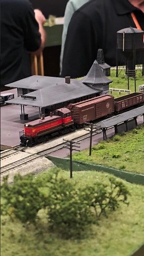 N Scale Chicago Great Western NW2 freight train passes rural station! #modeltrains #modelrailroad
