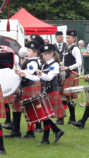 Combined Culter Pipebands march in playing "Green Hills of Tyrol" and "When the Battle's o'er" as they get ready to welcome the Chieftain to the 2024 North of Scotland Pipe Band Championship. This was held at King George V Park in Banchory on Sunday 12th May 2024. The band, which included many of the youngest players in the competition, consisted of the combined Culter & District Pipe Band with the 47th Culter Boys Brigade. This great event is thanks to the efforts of the organisers Banchory Dis