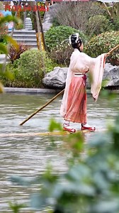 3.8K views · 268 reactions | This Chinese lady dressed in a traditional Chinese outfit stuns crowds of visitors with her elegant single bamboo drifting performance on water. | VideoChina | Facebook