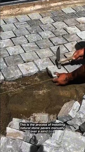 Skilled Craftsman Hand-Laying Natural Stone Cobblestone Pavers | Precision Masonry Installation