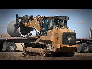 Cat® 973 Track Loader | Unloading Pipe