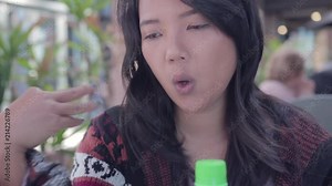 Funny Asian girl with hiccups