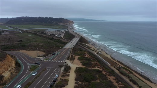 A Section Of The Pacific Coast Highway In San Diego, California near Torrey Pines State Natural Reserve - aerial drone shot | Premium Stock Video Footage