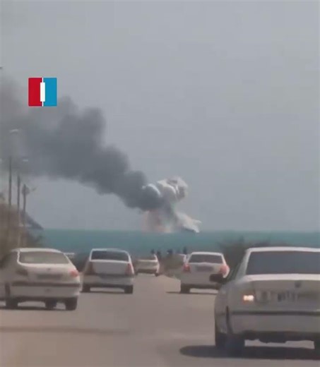Navy vessel exploding off the coast of Kangan in southern Iran.