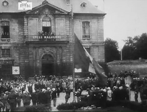 40K views · 1.5K reactions | French civilians gather outside the Lycée Malherbe in Caen to watch the raising of the flag on Bastille Day, 14 July 1944. The clip comes from a British newsreel covering the Battle for Caen. Find it in full here: https://bit.ly/4eNPUNy Film: IWM WPN 170 | Imperial War Museum London | Facebook