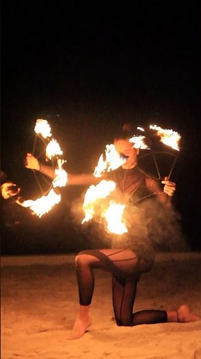 Spinning fire poi / fire fans in the Maldives
