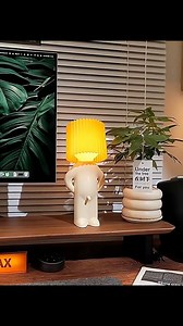 15K views · 160 reactions | Looking for a unique piece to liven up your space? This quirky table lamp is it! With a playful figure - shaped base and a vibrant, pleated lampshade, it's a statement - making decor item that doubles as a soft - glowing night light. Adds a touch of whimsy and warmth to any room. Perfect as a fun gift or a special addition to your own home decor collection. #TableLamp #HomeDecor #QuirkyDesign | EngineKit | Facebook
